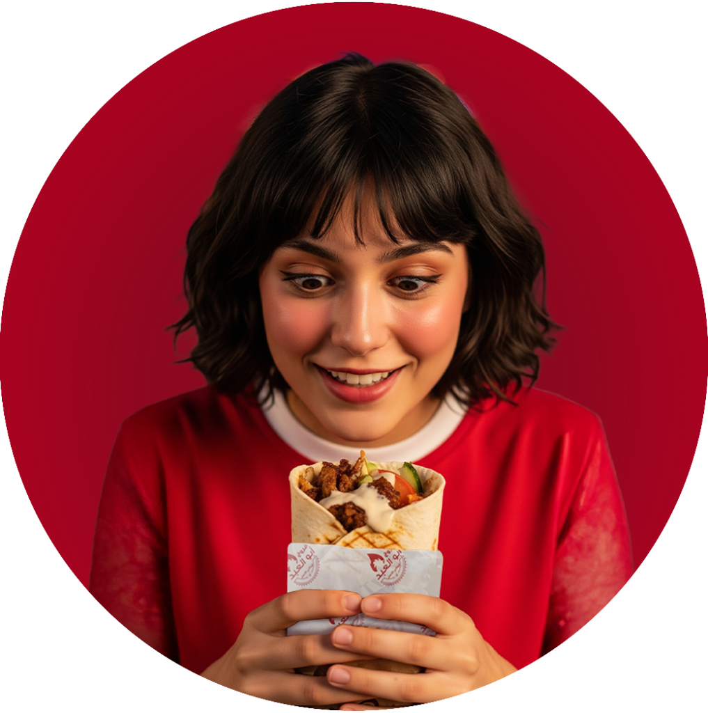 Woman eating Abo AlAbed Sandwich